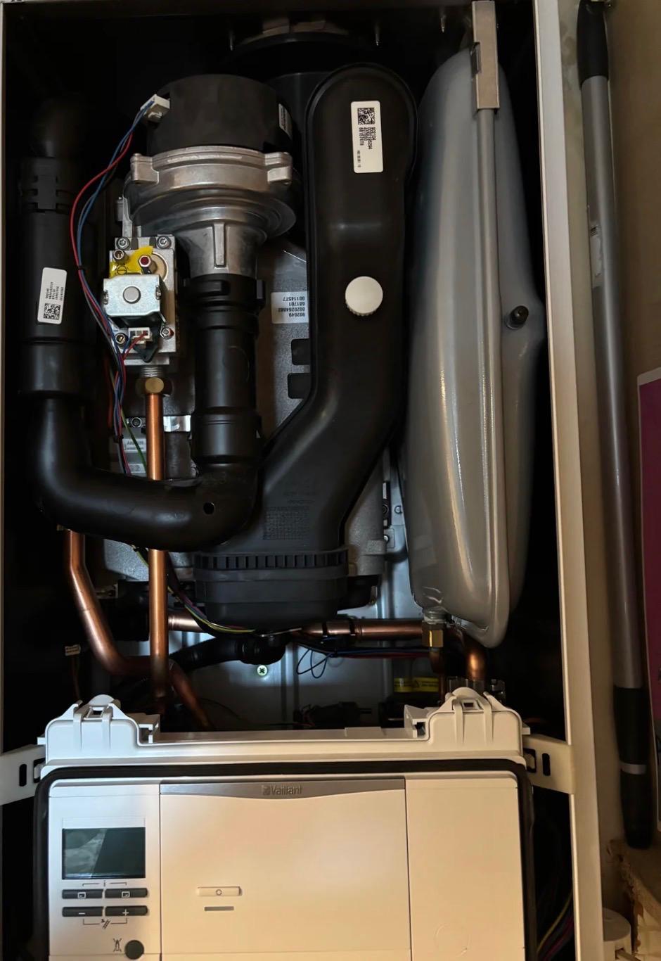 Vaillant gas boiler opened up showing internal components during a service